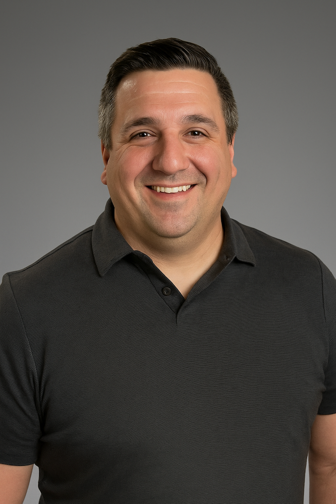 DSHICKEL Headshot - Gray Background Smaller.png